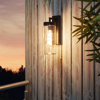 Eglo exterior wall light on a timber wall at dusk