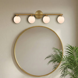 Telbix four light vanity bar above a round mirror